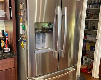 Side by side stainless refrigerator by Whirlpool 