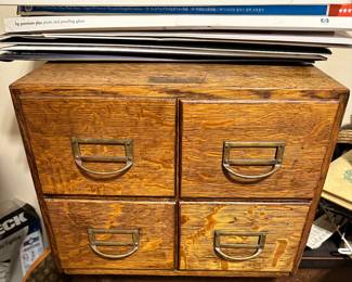 Small oak four drawer library cabinet