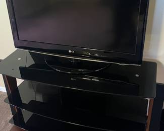 3 Smart TV’s with stands in both Smokey glass and solid oak