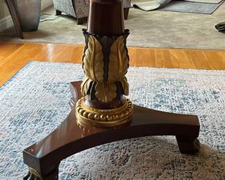 Gold gilded leaves at base of table