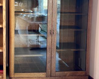Clean vintage oak kitchen hutch w/sturdy wood shelves and glass doors