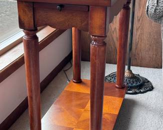 One of two narrow side tables
