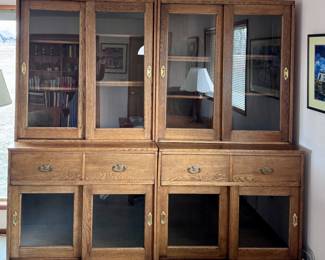 Two of three large book display cases w/sliding glass doors