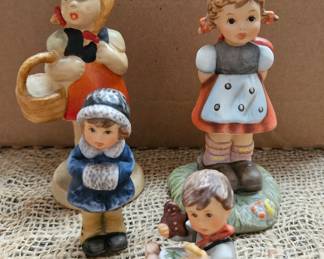 3 Goebel figurines with one homemade figurine