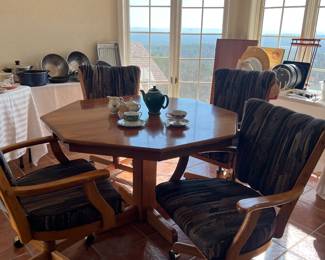 Kitchen table with leaf and four rolling chairs