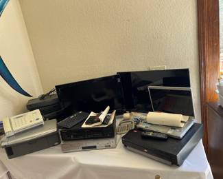 A huge collection of older stereos and electronics