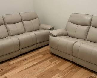 Recliner leather sofa and loveseat in off white. Light taupe.