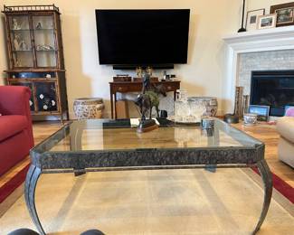 One of three recent smart LG TVs. Note the interesting antique Victorian bamboo and black display piece in back left corner.