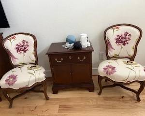 Pair of Victorian side chairs in light floral fabric.