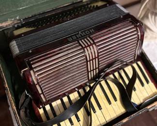 	#76	Hohner accordion with case	 $100.00 				