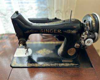 	#40	Vintage Singer sewing machine with cabinet	 $60.00 				
