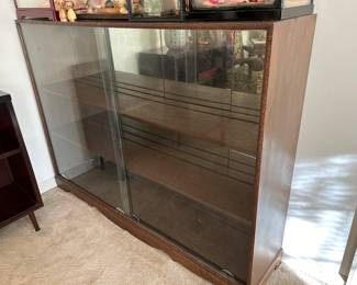	#36	Vintage cabinet with carving around the front, mirrored back and sliding glass doors as is 60x13x44	 $80.00 				