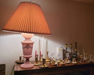 Gorgeous pink lamp and many candlesticks