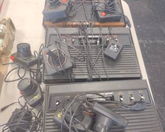 Three Atari game consoles and games