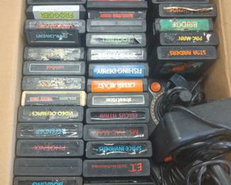 Three Atari game consoles and games