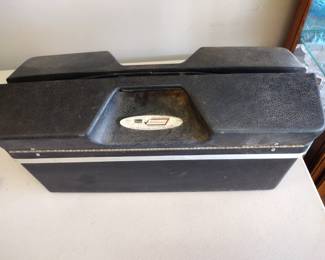 Vintage tackle box with lures.