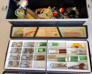 Vintage tackle box with lures.