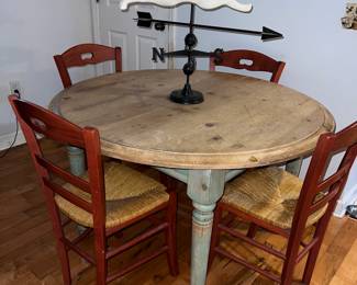 Primitive wood top round table with green legs $260 set of six red chairs as is $100