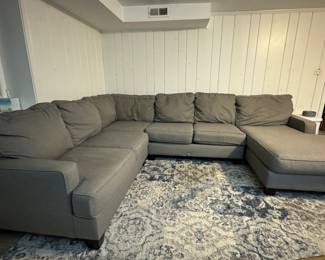Grey Sectional Sofa with Chaise. Chaise Section Measures 125" W. Other Section is 96" W; Chaise is 65" D. Photo 1 of 4.