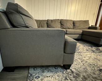 Grey Sectional Sofa with Chaise. Chaise Section Measures 125" W. Other Section is 96" W; Chaise is 65" D. Photo 2 of 5.