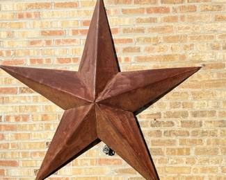 Round Top Antique Festival Sourced Metal Five-Point Star. Measures 66" H x 66" H.