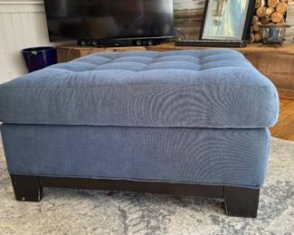 Blue Tufted Top Ottoman with Ebonized Wood Base. Measures 36" x 36". Photo 1 of 2.