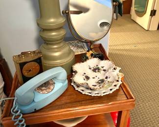 Blue phone, mirror , brass clock 