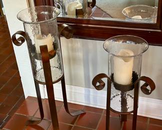 2 glass hurricanes , stands , with candles 