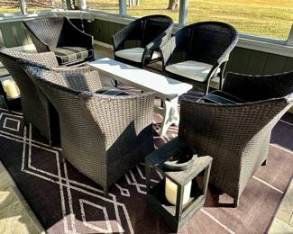 Outdoor Wicker Patio Set includes: Set of 4 Chairs with Striped Cushions and 2 Additional Chairs with the White Cushions. White Bench Style Table