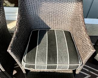 Outdoor Wicker Patio Set includes: Set of 4 Chairs with Striped Cushions and 2 Additional Chairs with the White Cushions. White Bench Style Table