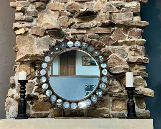 View of Round Mirror and Candlesticks on the Mantle