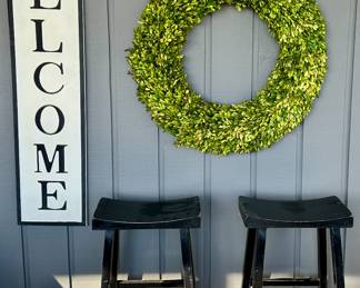 Cool Welcome Sign with 2 Pottery Barn Stools and Wreath in Sun Room.