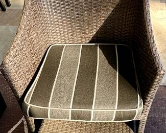 Outdoor Wicker Patio Set includes: Set of 4 Chairs with Striped Cushions and 2 Additional Chairs with the White Cushions. White Bench Style Table