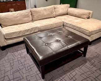 Sweet sectional with a chaise, corner and two seated sofa and a very lovely leather ottoman