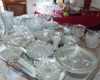 TABLE FULL OF ANTIQUE AND VINTAGE CUT, PRESSED CUT AND CUT GLASS PIECES