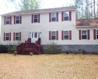 FRONT OF HOUSE. THE FRONT DOOR WILL BE LOCKED, ENTER FROM THE SIDE