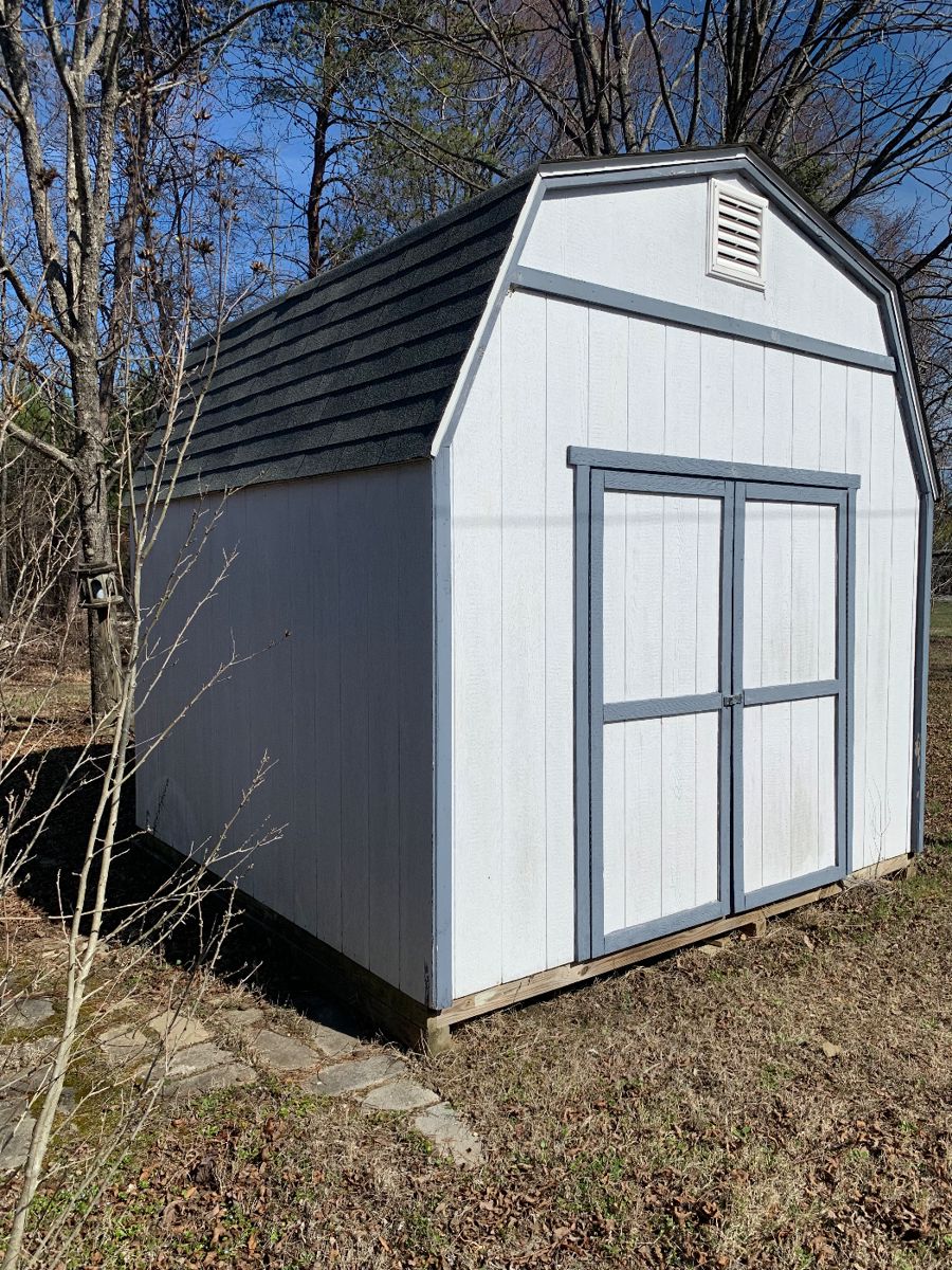 10’x10’x 15’ barn. 6’ double doors and built in loft with two vents. Buyer must move. 