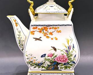 Vintage porcelain teapot & stand by Franklin Mint.  It is a tribute to 16th century Japanese Rimpa style teapot.  