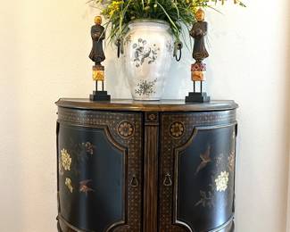 A polychrome demilune cabinet 