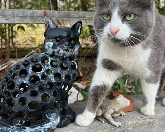Metal cat sculpture 
(Note: Real kitty is shown for size reference and is not for sale.)