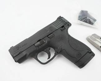Smith & Wesson's popular M&P Shield Semi-Auto Pistol operates with a striker-fired action, eliminating any external hammer to catch on clothing when this handgun is carried concealed. The thin 1" profile aids with concealment. The operation is based on a polymer frame and coated stainless steel action. Other features of the S&W M&P Shield pistol are white dot rear and front sights, 2-piece trigger, textured grip, extended magazine that increases grip surface, and rounded features to make the handgun more concealed carry. THis pistol comes with two mags and a speed loader. This Pistol is in excellent condition showing normal signs of use and wear.