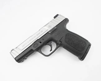 Designed for concealed carry and home defense, Smith & Wesson SD40 VE Semi-Auto Pistol operates with a striker-fired action (no external hammer) that's activated with a 2-piece Self Defense Trigger for consistent pull. This pistol has a distinctive two-tone look with a polymer frame and contrasting stainless steel slide. Aiming is easy with a white dot front and dual white dot rear sight. The textured grip aids with control. A standard Picatinny rail under the muzzle and built into the frame allows easy accessory attachment. Other desirable features found on this S&W SD40 pistol are aggressive front and backstrap texturing on the grip, front and rear serrations on the slide to aid with operation, and a textured finger locator on the side of the frame above the trigger. This pistol is in excellent condition showing normal signs of use and wear.