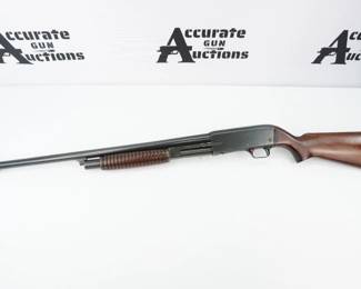 Stevens Model 820B Pump Action 12 Gauge Shotgun. The barrel is marked "Stevens Savage Arms. Chicopee Falls, Mass." and "Model 820B". 2.75" chamber. Blued finish. Walnut furniture,Champion master shooting muzzle break and a half length magazine tube. The shotgun has no visible serial number. This shotgun is in excellent condition showing normal signs of use and wear. 