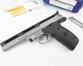 Serial # UBJ7047 Condition: Excellent This Smith & Wesson Model 22A-1, is a semi-automatic pistol chambered in .22LR The 22A-1 is a full-size pistol with an aluminum alloy frame. The steel barrel has an integrated Weaver style rail (similar to a Picatinny). This pistol is distinguished by two features: An integral rail along the top edge of the gun permits easy mounting of optical sights and other accessories. The gun's alloy frame and alloy-shrouded barrel help keep weight down for a full-sized pistol. This is a perfect option for target shooting in competitions or for some recreational fun. This pistol comes with 2 mags and the original case .This pistol is in excellent condition showing normal signs of use and wear.