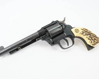 Serial # 1758666 Condition: Excellent The Double 9 W-104 Features a 5.5 inch barrel and is chambered in 22 lr. SN 1758666. This revolver has a Chip in the bottom left of the grip. This revolver is in Very good condition showing signs of use and wear. 