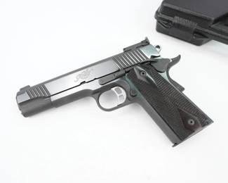 Serial # K054385 Condition: Excellent This first gen Kimber classic gold match. It has a 5-inch barrel with a front and rear serrated blue finished slide. It has a blade front sight and an adjustable square notch rear sight. The grip panels are a diamond checkered. The aluminum trigger is adjustable and grooved and the hammer is ringed and serrated. This gun has an overall great texture that ensures a great grip. It shows minimal signs of use and wear. It comes with a black Kimber hard case with foam inserts.