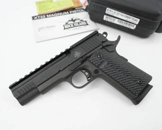 Serial # XTM023036 Condition: Very Good Country: The XT Magnum is calibered in a powerful The XT Magnum is calibered in a powerful 22 magnum cartridge with a 14-round capacity. The 5" barrel with a crisp, factory 4- to 6-pound trigger to offer match class accuracy and power. Includes low profile anti-snag angle front and rear sight with skeletonized hammer and trigger with adjustable over travel stop. The XT Magnum is finished with rock-tough parkerized coating, fitted checkered rubber grips and comfort extended beavertail safety. This is sold with one magazine and the factory case. 