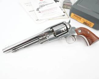 Ruger Old Army Model 01406 Fixed sight 7 1/2" barrel. This Cap and Ball revolver is no longer made.The Ruger Old Army is a black-powder percussion revolver introduced in 1972 by the Sturm, Ruger company and manufactured through 2008. This design was built around the Blackhawk, but it takes its styling cues from the Spiller and Burr cap and ball pistol. This is due to the frame being longer in front to accommodate the loading lever and pivot pin. This revolver is chambered in .457 BP and features a 7.5” barrel and wood grips. Comes with original box. The revolver is in excellent condition, showing minimal signs of use and wear.