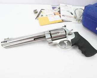 We all grew up hearing the phrase, "Faster than a speeding bullet...," but not when it is fired from Smith & Wesson's new Model 460XVR, with the highest muzzle velocity of any production revolver on earth. The Model 460XVR is so revolutionary that it required an entirely new designation...XVR, X-treme Velocity Revolver.Starting with their Extra Large Frame, the Smith & Wesson engineers worked to deliver maximum velocity - over 2,300 feet per second - to reach the target faster than ever before. The 460XVR has interchangeable compensators to accommodate every load. Only Smith & Wesson could deliver this much power, and this much velocity in a precision, production revolver. This revolver comes with the original case and is in excellent condition showing minimal signs of use and wear. 