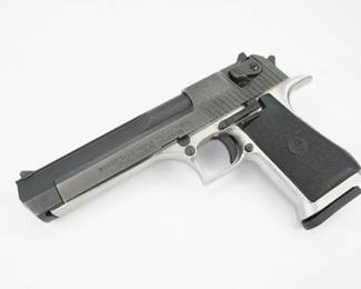 Serial # 52101-S Condition: Shiny The Desert Eagle is a semi-automatic pistol known for chambering the largest centerfire cartridge of any magazine-fed, self-loading pistol. It is regarded as a pistol with high stopping power. Magnum Research Inc. (MRI) designed and developed the Desert Eagle. The design was refined and the pistols were manufactured by Israel Military Industries (IMI) until 1995, when MRI shifted the manufacturing contract to Saco Defense in Saco, Maine. In 1998, MRI moved manufacturing back to IMI, which later commercialized its small arms branch under the name Israel Weapon Industries. This Desert Eagle is chambered in the less common .41/44 Mag and features a 6” barrel and one magazine. The pistol is in excellent condition, showing minimal signs of use and wear. 